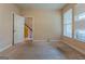 Carpeted bedroom with a view of the outside from the windows at 275 Autry Mill Ln, Suwanee, GA 30024