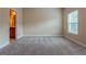 Spacious bedroom with natural light and carpet floors at 275 Autry Mill Ln, Suwanee, GA 30024