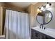 Clean and bright bathroom with updated vanity, fixtures, and neutral paint at 327 Old Muse Rd, Carrollton, GA 30116