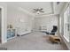 Bright and roomy bedroom featuring a white crib, a sitting chair, and multiple windows with views at 733 Wexford Cove Way, Mableton, GA 30126