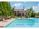 Large community pool with sundeck and surrounding trees at 733 Wexford Cove Way, Mableton, GA 30126