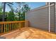 Private outdoor deck with wood railings and a view of lush greenery at 733 Wexford Cove Way, Mableton, GA 30126