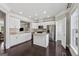 Bright, open kitchen with white cabinetry, stainless steel appliances, and granite countertops at 733 Wexford Cove Way, Mableton, GA 30126