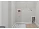 Simple laundry room area with washer and dryer hookups at 733 Wexford Cove Way, Mableton, GA 30126