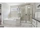 Modern primary bath with a separate shower and a soaking tub with tile surround at 733 Wexford Cove Way, Mableton, GA 30126
