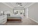 Spacious main bedroom featuring tray ceiling, ceiling fan, and an attached sitting room at 733 Wexford Cove Way, Mableton, GA 30126