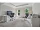 Sitting room with desk, chair, and two windows overlooking a private yard at 733 Wexford Cove Way, Mableton, GA 30126