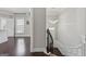 Elegant staircase featuring dark hardwood floors and decorative lighting fixtures at 733 Wexford Cove Way, Mableton, GA 30126