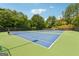Community tennis courts surrounded by shade trees at 733 Wexford Cove Way, Mableton, GA 30126