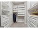 Organized walk-in closet featuring custom shelves, drawers, and ample hanging space at 733 Wexford Cove Way, Mableton, GA 30126
