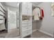 Organized walk-in closet with custom shelving for optimal storage solutions at 733 Wexford Cove Way, Mableton, GA 30126