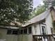 This is the front exterior of the property featuring a small porch and interesting decor at 11591 Turner Rd, Hampton, GA 30228