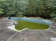 A large outdoor pool in need of some cleaning and maintenance to be fully enjoyed at 11591 Turner Rd, Hampton, GA 30228