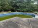 A large outdoor pool in need of some cleaning and maintenance to be fully enjoyed at 11591 Turner Rd, Hampton, GA 30228