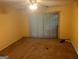 Bright bedroom with sliding glass doors to the outside, ceiling fan, and neutral-toned walls at 7 Willowick Dr, Lithonia, GA 30038