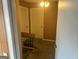 Upstairs hallway featuring neutral-colored walls, carpeted floor, and two white doors at 7 Willowick Dr, Lithonia, GA 30038