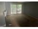 Open living room featuring sliding door access to the outdoors, with a fireplace and neutral wall color at 7 Willowick Dr, Lithonia, GA 30038