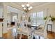 Elegant dining area featuring hardwood floors, stylish lighting, and comfortable seating at 117 Elkins Blvd, Locust Grove, GA 30248