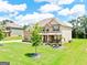 Charming home with a lush front lawn, well-manicured landscaping, and inviting curb appeal at 117 Elkins Blvd, Locust Grove, GA 30248