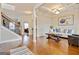 Comfortable living room featuring hardwood floors, a coffered ceiling, and stylish furniture at 117 Elkins Blvd, Locust Grove, GA 30248