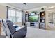 Comfortable living room featuring a television, and custom shelving unit with built in drawers at 117 Elkins Blvd, Locust Grove, GA 30248