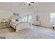 Spacious main bedroom with a vaulted ceiling, neutral color palette, and carpet flooring at 117 Elkins Blvd, Locust Grove, GA 30248