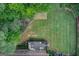 Aerial view of the backyard highlighting the deck, play area and lawn at 1952 Sugarstone Dr, Lawrenceville, GA 30043
