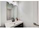 Modern bathroom featuring a sleek vanity with a large mirror and updated fixtures at 1952 Sugarstone Dr, Lawrenceville, GA 30043