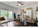 Craft room with hardwood floors, natural light, and storage at 1952 Sugarstone Dr, Lawrenceville, GA 30043