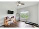 Bright workout room with hardwood floors, ceiling fan, and large window at 1952 Sugarstone Dr, Lawrenceville, GA 30043