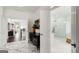 Bright foyer featuring marble flooring and open access to the bathroom and other living areas at 1952 Sugarstone Dr, Lawrenceville, GA 30043