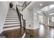 Grand foyer features hardwood floors, elegant staircase, and detailed trim work, offering a welcoming entrance at 1952 Sugarstone Dr, Lawrenceville, GA 30043