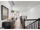 Upstairs hallway features hardwood floors, neutral paint, and natural lighting at 1952 Sugarstone Dr, Lawrenceville, GA 30043
