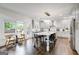Bright kitchen with an island, stainless appliances, and breakfast table with backyard view at 1952 Sugarstone Dr, Lawrenceville, GA 30043