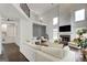 Bright living room with white walls, hardwood floors, and a decorative accent wall at 1952 Sugarstone Dr, Lawrenceville, GA 30043