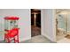 View of the media room leading to a bathroom with white marbled tile and a corner shower at 1952 Sugarstone Dr, Lawrenceville, GA 30043