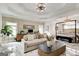 Spacious main bedroom features tray ceilings, a sitting area and marble floors for luxurious comfort at 1952 Sugarstone Dr, Lawrenceville, GA 30043