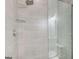 Contemporary shower with gray tile and glass door at 1952 Sugarstone Dr, Lawrenceville, GA 30043