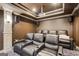 Home theater featuring tiered seating with leather recliners, custom lighting, and a projector system at 1952 Sugarstone Dr, Lawrenceville, GA 30043