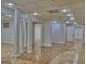 Open finished basement area showing support columns, recessed lighting, and parquet flooring at 902 Sweetbay Ct, Stockbridge, GA 30281