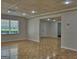 Bright basement area with parquet floors, a window providing natural light, and access to other rooms at 902 Sweetbay Ct, Stockbridge, GA 30281