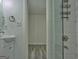 This bathroom features a glass-door shower and sink with modern fixtures at 902 Sweetbay Ct, Stockbridge, GA 30281