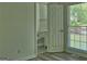 Bedroom featuring wood floors, bright natural light and an attached bathroom at 902 Sweetbay Ct, Stockbridge, GA 30281