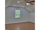 Bedroom featuring wood floors, recessed lighting, and a window with a lovely view at 902 Sweetbay Ct, Stockbridge, GA 30281