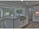 Gourmet kitchen featuring an island sink, stainless steel appliances, and natural light at 902 Sweetbay Ct, Stockbridge, GA 30281