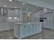 Spacious kitchen with a center island, modern appliances, and plenty of cabinet space at 902 Sweetbay Ct, Stockbridge, GA 30281