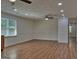 Spacious living room with wood floors, recessed lighting, and natural light at 902 Sweetbay Ct, Stockbridge, GA 30281