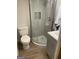 Compact bathroom features a toilet, shower, and modern vanity at 103 Chipstone Ct, Peachtree City, GA 30269
