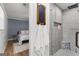 Modern bathroom shows tiled shower with glass door, white towels, and adjoins bedroom at 103 Chipstone Ct, Peachtree City, GA 30269