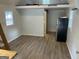 Bright and spacious interior with modern flooring, loft access, and a mini fridge at 103 Chipstone Ct, Peachtree City, GA 30269